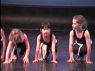 Picture of Christina in the center of adance trio.