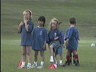 Lining up for practice kicks before the match.